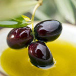 dipping-olive-sprig-with-black-olives-in-olive-oil-OKOK.jpg